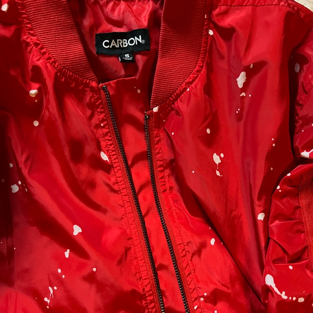 Red windbreaker jacket